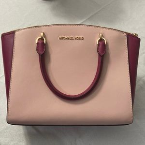 Pink and burgundy Michael kors medium purse.